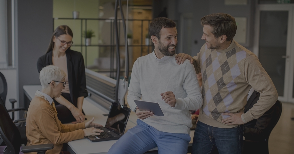 Business people working and communicating while standing in the